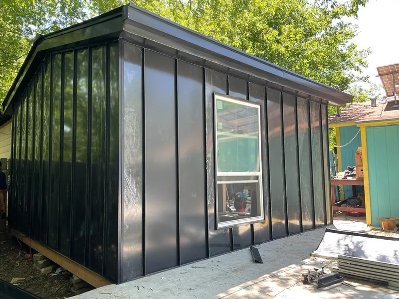 Black standing seam metal wall panels for Roof Inspection in Halls